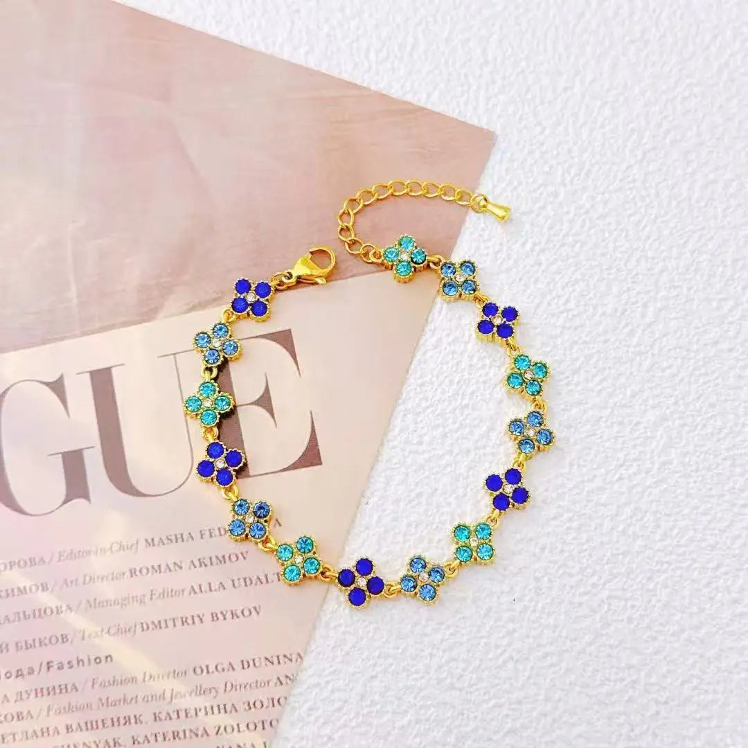 Bracelet en acier inoxydable doré – Fleurs & Cristaux
